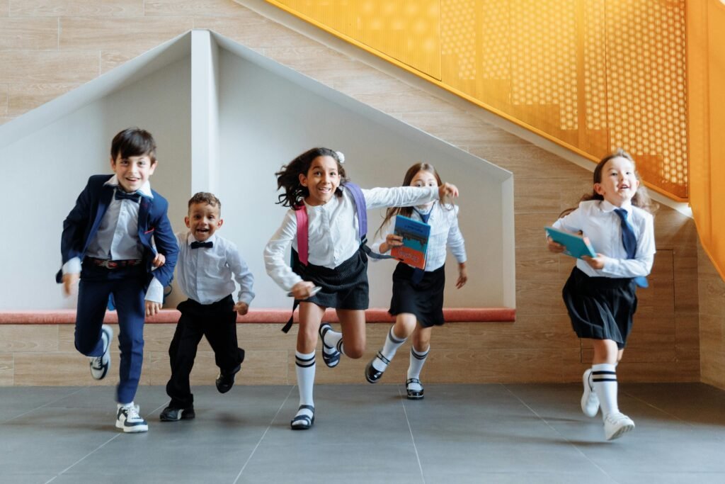 School children happily running in uniform, symbolizing energy, joy, and the positive impact of morning routines