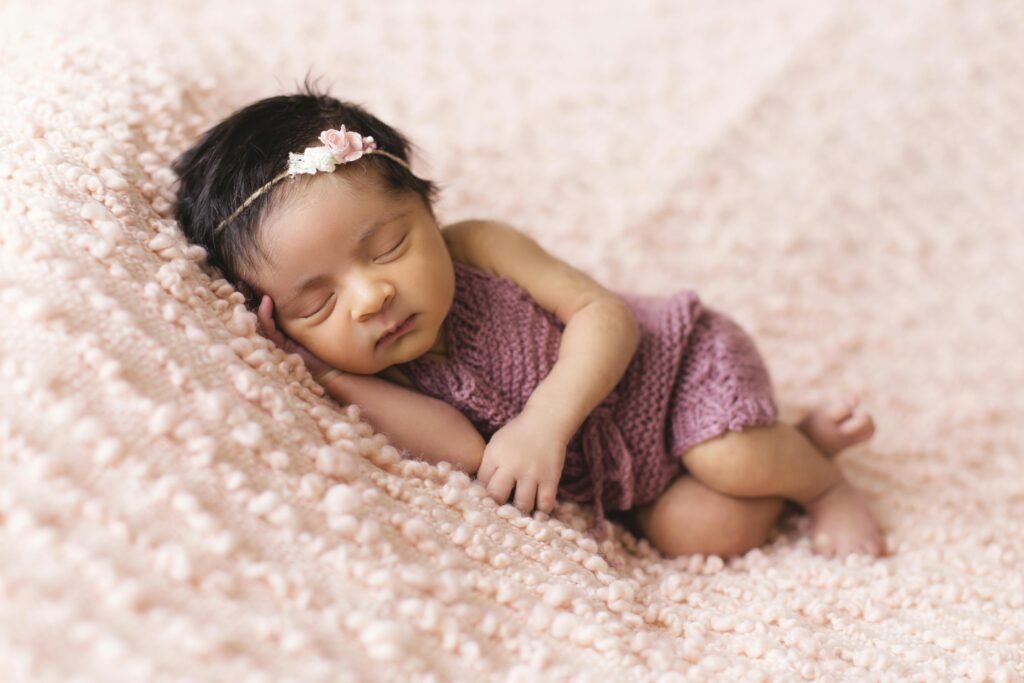 Cute baby sleeping calmly with peaceful expression, symbolizing restful sleep and comfort